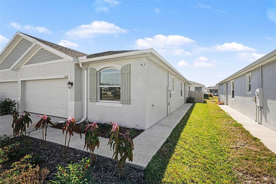 Exterior details and patio area of a home in Woodcreek, Wesley Chapel (Image 23).