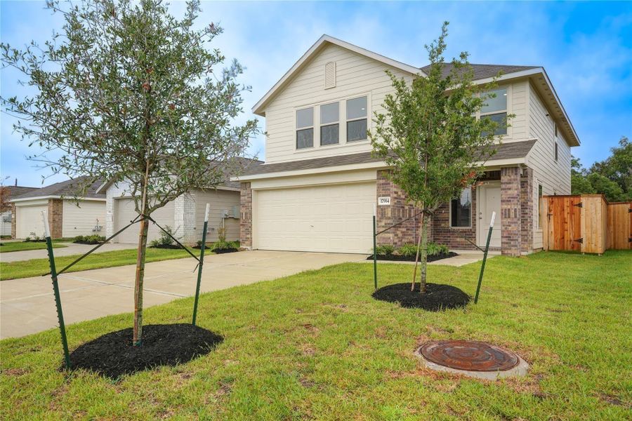 Front exterior of a new home in Becker Landing, Hockley, TX, highlighting curb appeal (Image 1). Front exterior of a new home in Becker Landing, Hockley, TX, highlighting curb appeal (Image 1).