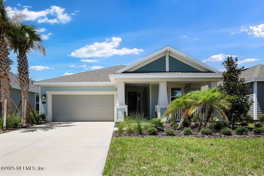 Front exterior of a new home in Colbert Landings, Palm Coast, FL, highlighting curb appeal (Image 19).