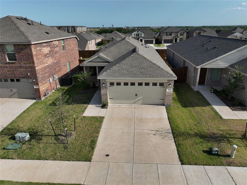 Front exterior of a new home in Hurricane Creek, Anna, TX, highlighting curb appeal (Image 21). Front exterior of a new home in Hurricane Creek, Anna, TX, highlighting curb appeal (Image 21).