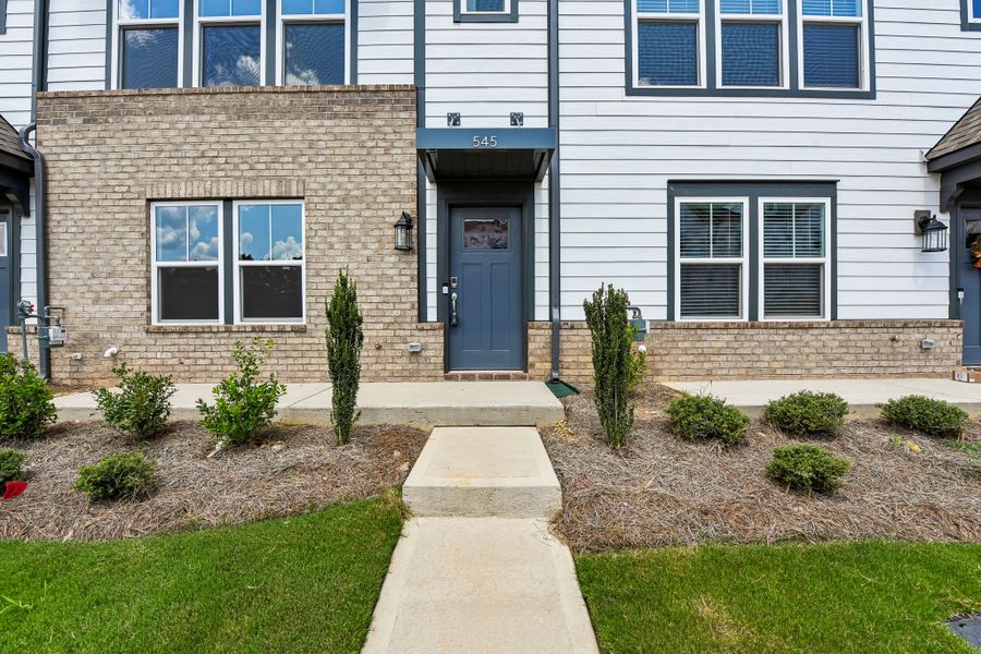 Exterior details and patio area of a home in Indian Trail Townhomes, Indian Trail (Image 22).