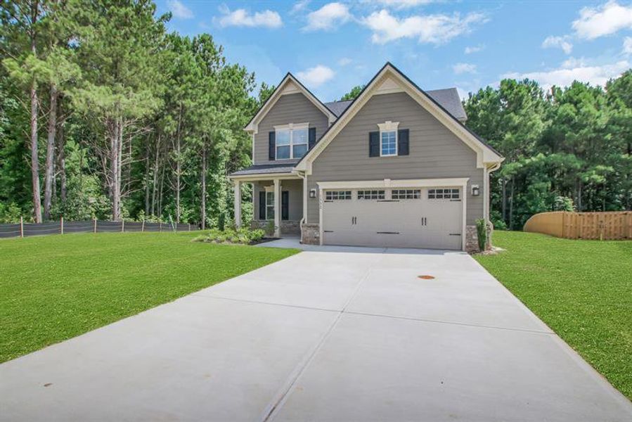 Front exterior of a new home in Southern Hills, McDonough, GA, highlighting curb appeal (Image 2). Front exterior of a new home in Southern Hills, McDonough, GA, highlighting curb appeal (Image 2).