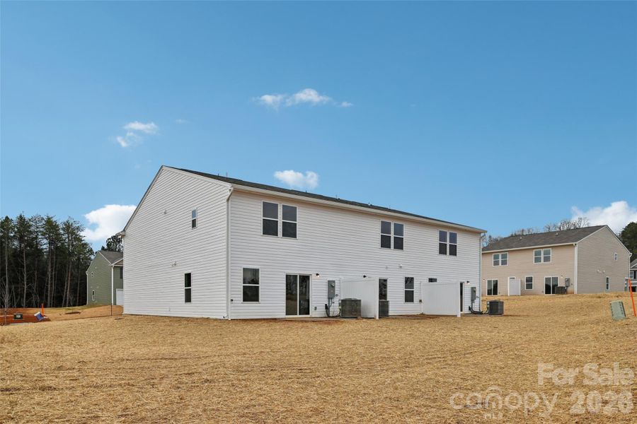 Exterior details and patio area of a home in The Towns at Green Needles, Lexington (Image 4).
