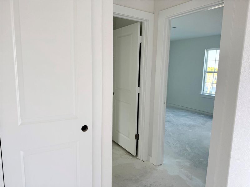 Corridor featuring concrete floors