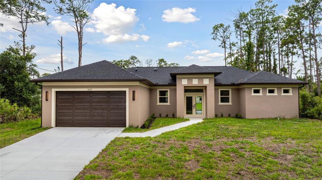Front exterior of a new home in , North Port, FL, highlighting curb appeal (Image 1). Front exterior of a new home in , North Port, FL, highlighting curb appeal (Image 1).