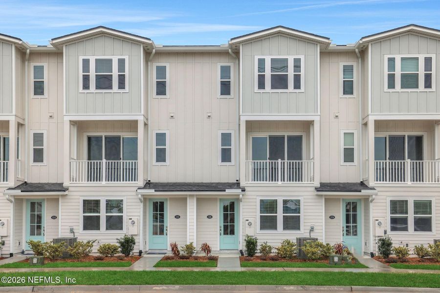 Front exterior of a new home in , Jacksonville Beach, FL, highlighting curb appeal (Image 23).