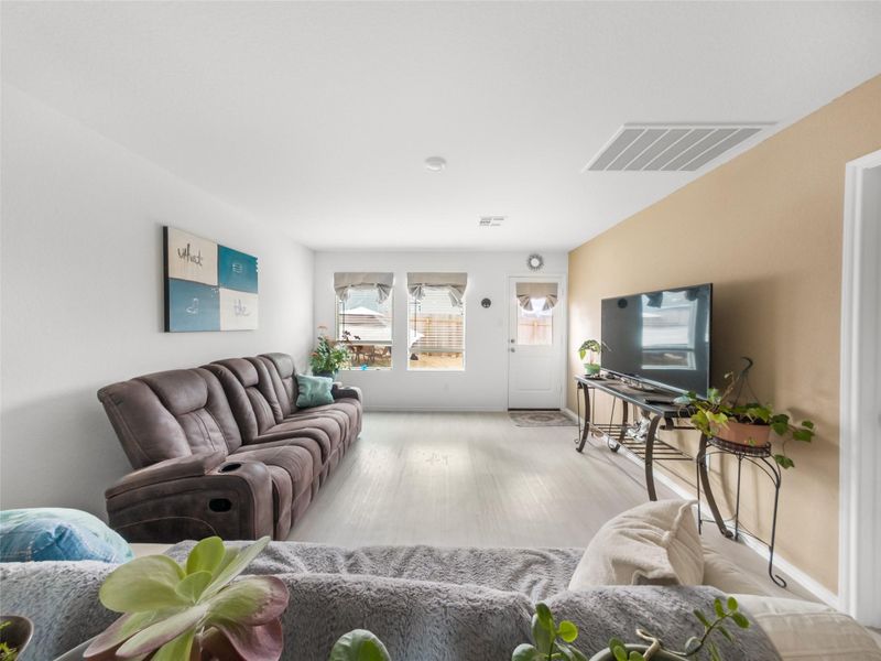 Living room featuring wood finished floors and baseboards