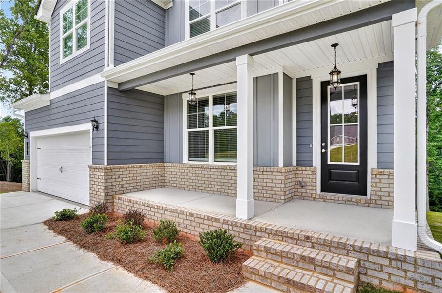 Exterior details and patio area of a home in Waters Edge, Mansfield (Image 3).