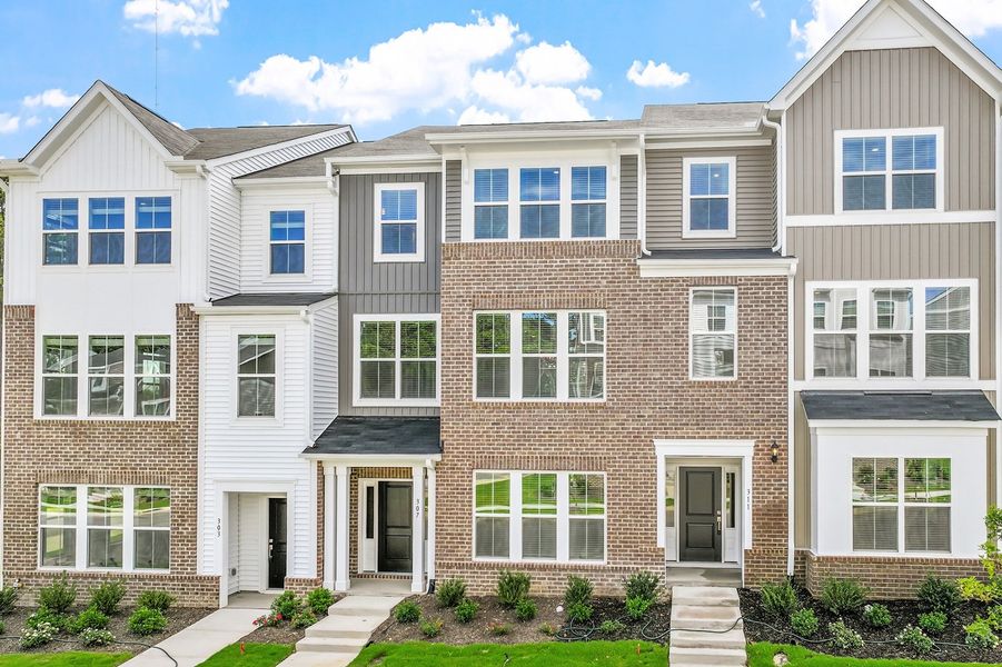 Front exterior of a new home in Renaissance at White Oak, Garner, NC, highlighting curb appeal (Image 23). Front exterior of a new home in Renaissance at White Oak, Garner, NC, highlighting curb appeal (Image 23).