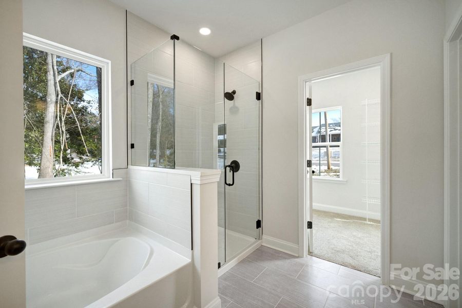 Primary Garden Tub And Frameless Glass Shower