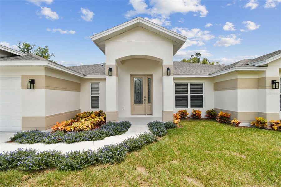 Front exterior of a new home in , Lutz, FL, highlighting curb appeal (Image 22).