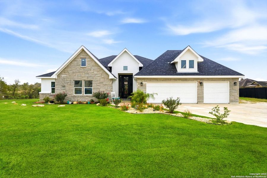 Front exterior of a new home in , Kyle, TX, highlighting curb appeal (Image 1). Front exterior of a new home in , Kyle, TX, highlighting curb appeal (Image 1).