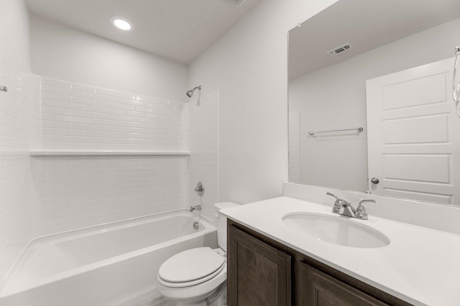 Representative exterior photo of a completed home built from the Conroe by Impression Homes in Creekshaw, Royse City, TX (Image 19). Representative exterior photo of a completed home built from the Conroe by Impression Homes in Creekshaw, Royse City, TX (Image 19).