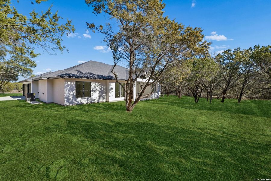 Exterior details and patio area of a home in , Spring Branch (Image 4).
