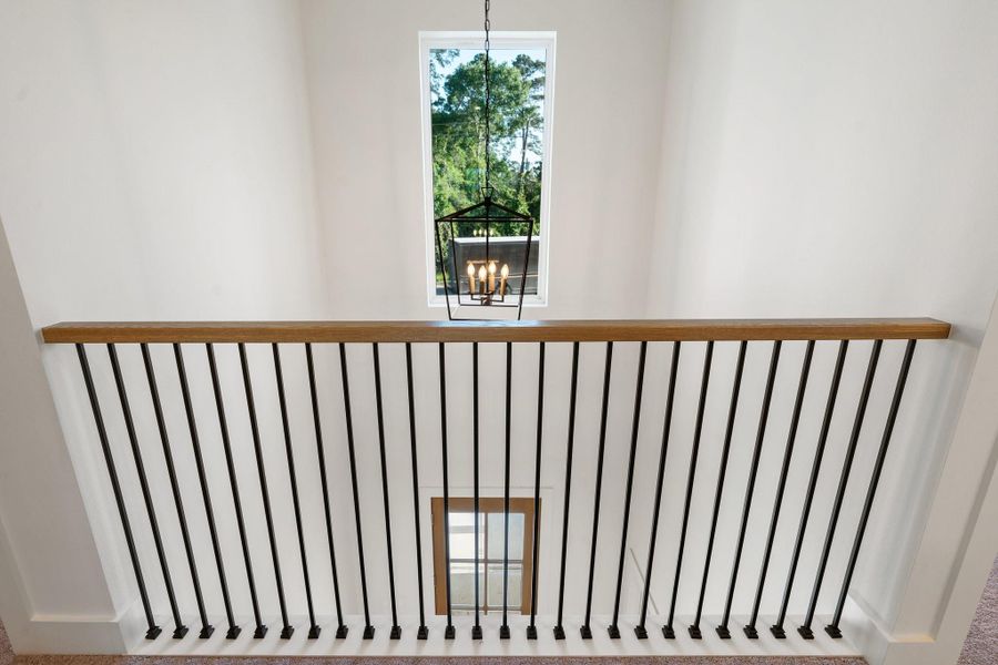 View of the entrance of the home from upstairs. View of the entrance of the home from upstairs.