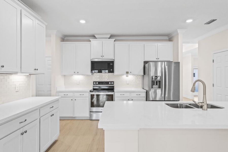 Furnished interior view inside a new home in Windswept Estates, Freeport (Image 7).