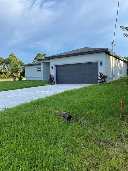 Front exterior of a new home in , Palm Bay, FL, highlighting curb appeal (Image 14). Front exterior of a new home in , Palm Bay, FL, highlighting curb appeal (Image 14).