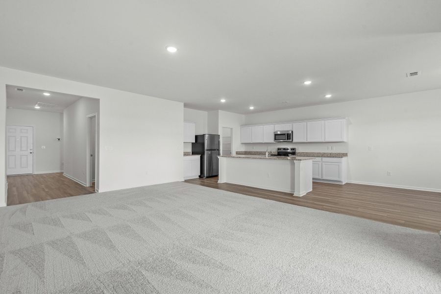 Representative unfurnished interior of a home built from the Europa by Starlight Homes in Oakfield Lakes, Parrish (Image 14).