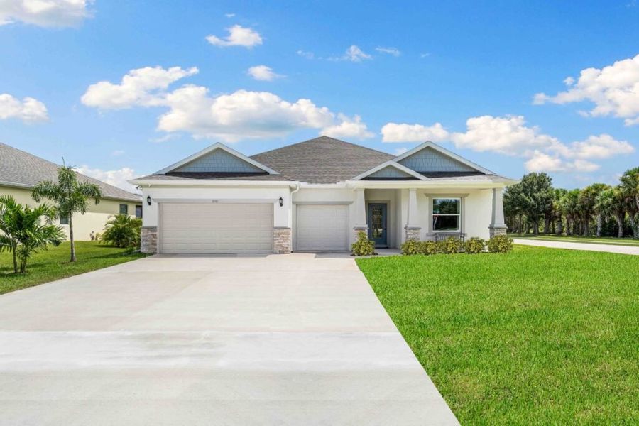 Representative exterior photo of a completed home built from the Sanibel by Holiday Builders in Port St Lucie, Port St. Lucie, FL (Image 1).