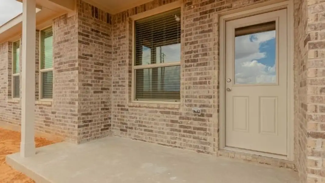 Exterior details and patio area of a home in Mustang Ridge, Andrews (Image 3).