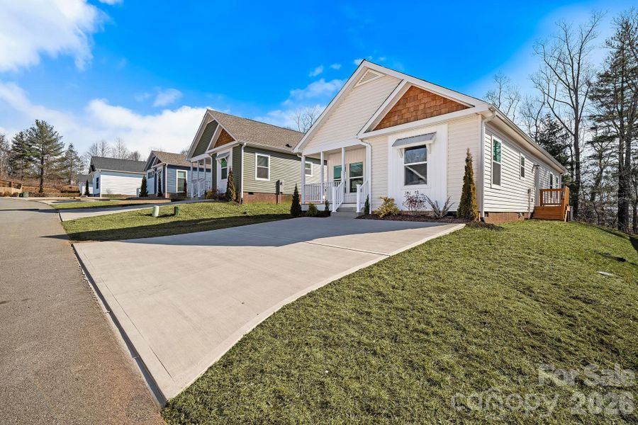 Front exterior of a new home in , Asheville, NC, highlighting curb appeal (Image 27).