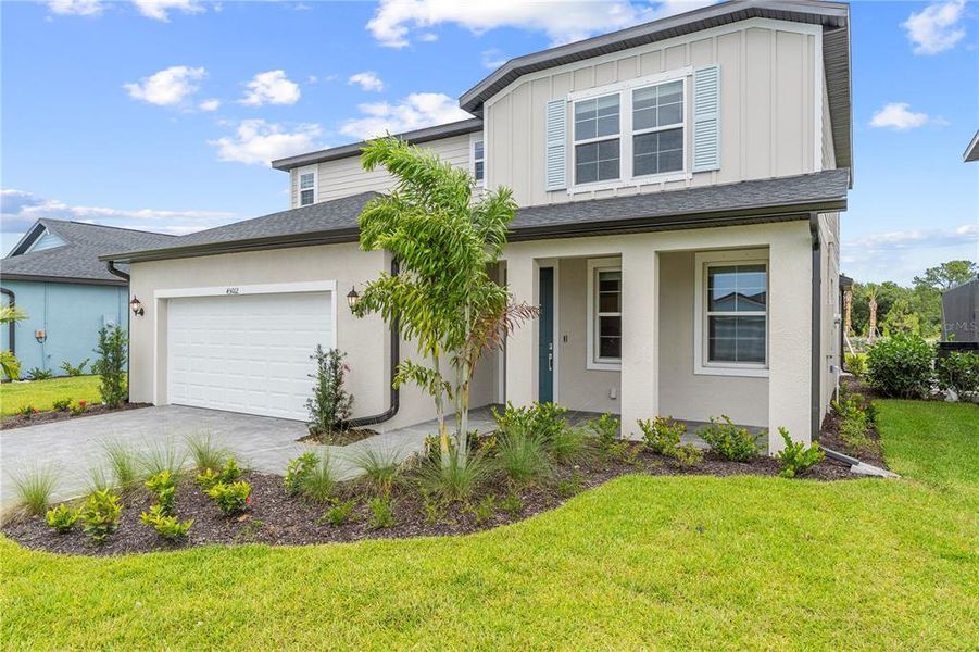 Front exterior of a new home in Sabal Glen at Babcock Ranch, Punta Gorda, FL, highlighting curb appeal (Image 1). Front exterior of a new home in Sabal Glen at Babcock Ranch, Punta Gorda, FL, highlighting curb appeal (Image 1).