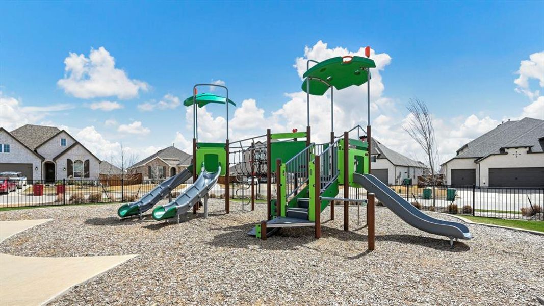 Communal playground featuring a residential view Communal playground featuring a residential view