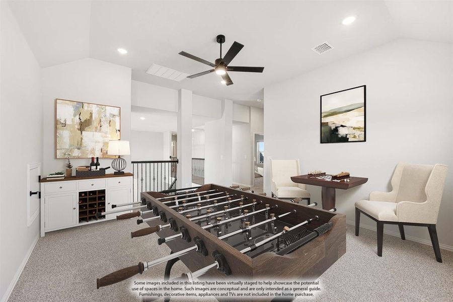 Game room with foosball table, ceiling fan, carpet flooring, and white built-in cabinet with wine rack