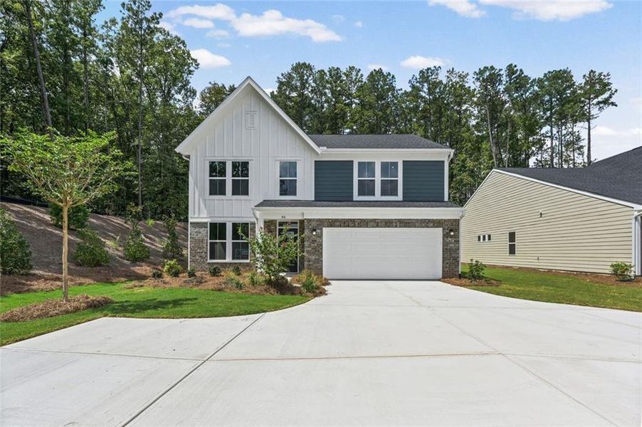 Front exterior of a new home in Easton Park, Dallas, GA, highlighting curb appeal (Image 23).