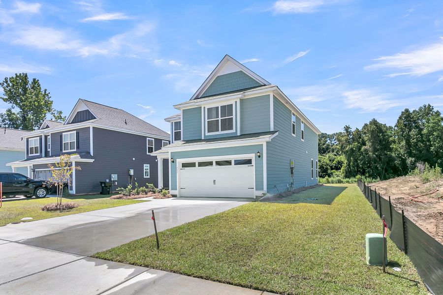 Front exterior of a new home in Abbey Walk, Moncks Corner, SC, highlighting curb appeal (Image 2). Front exterior of a new home in Abbey Walk, Moncks Corner, SC, highlighting curb appeal (Image 2).
