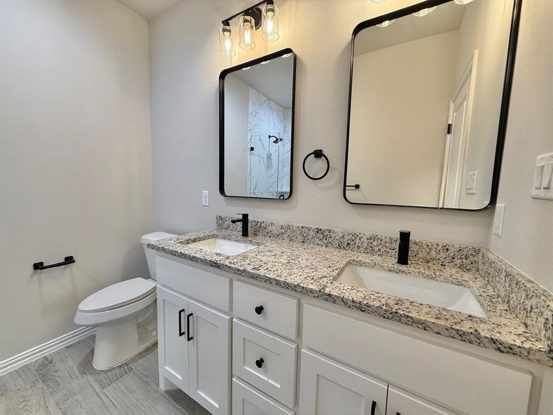 Bathroom with toilet and vanity