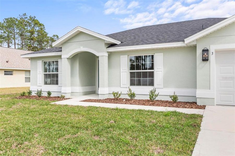 Front exterior of a new home in , Palm Coast, FL, highlighting curb appeal (Image 23).