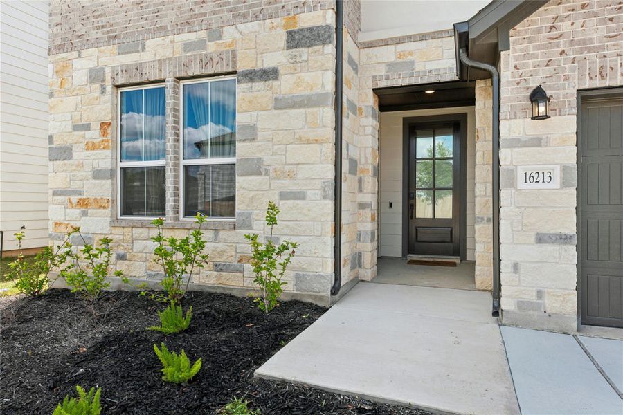 Property entrance with masonry front elevation