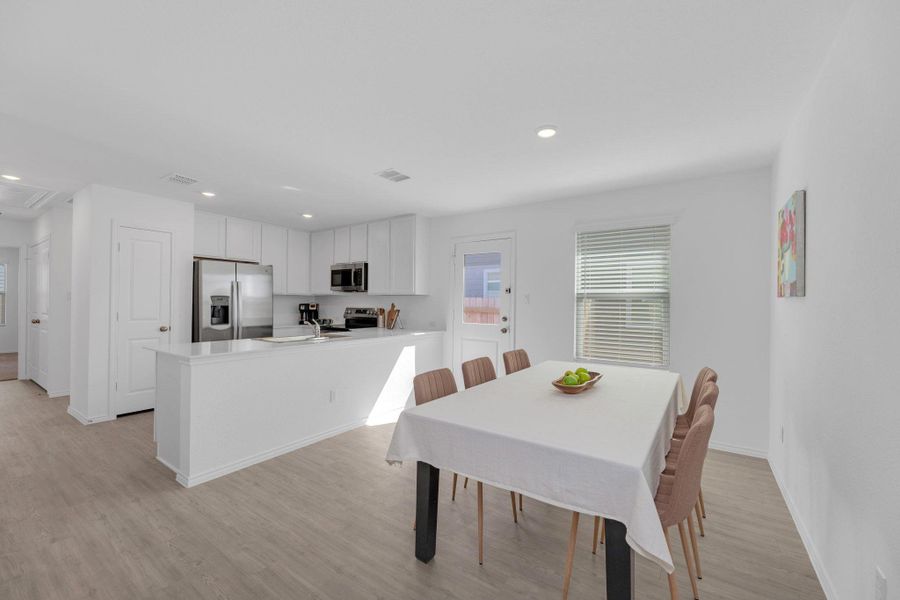 Dining area featuring recessed lighting and light vinyl flooring.