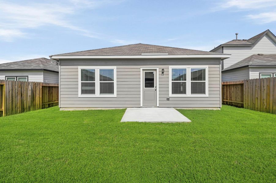 Exterior details and patio area of a home in Barrett Crossing, Crosby (Image 4).
