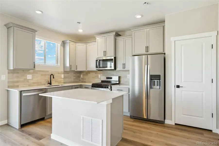 Furnished interior view inside a new home in Second Creek Farm, Commerce City (Image 7).