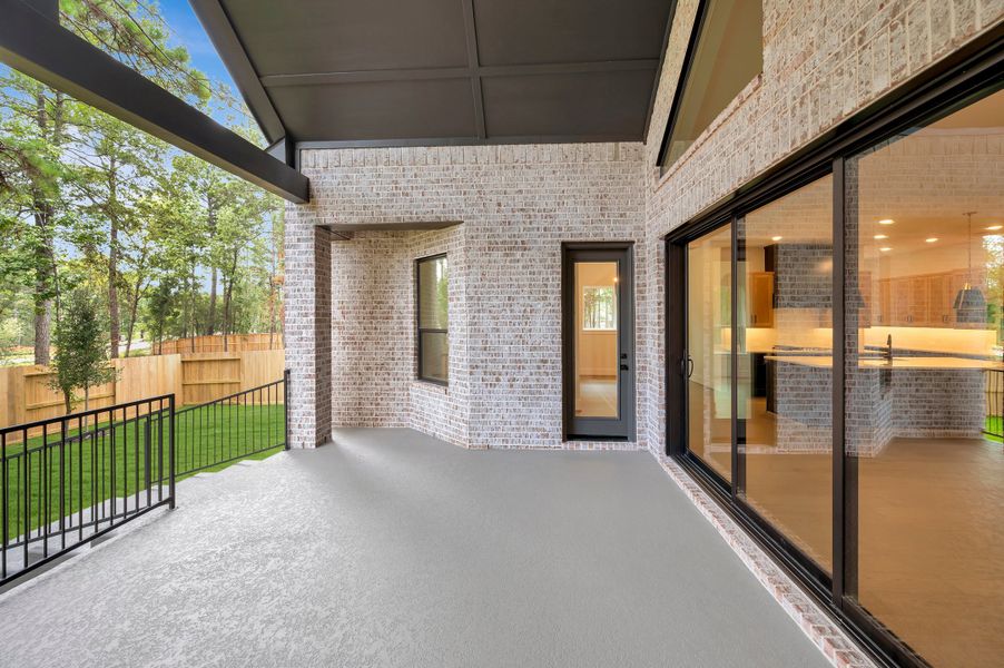 Exterior details and patio area of a home in The Woodlands Hills - Premier Collection, Willis (Image 4). Exterior details and patio area of a home in The Woodlands Hills - Premier Collection, Willis (Image 4).