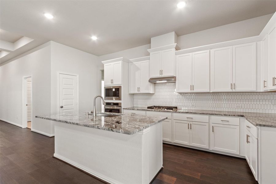 Furnished interior view inside a new home in Sunterra, Katy (Image 11).