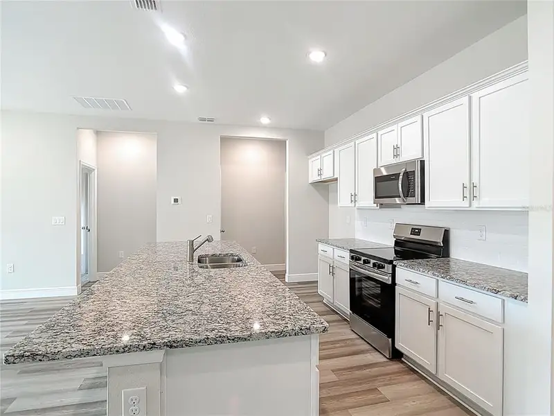 Furnished interior view inside a new home in , North Port (Image 39).
