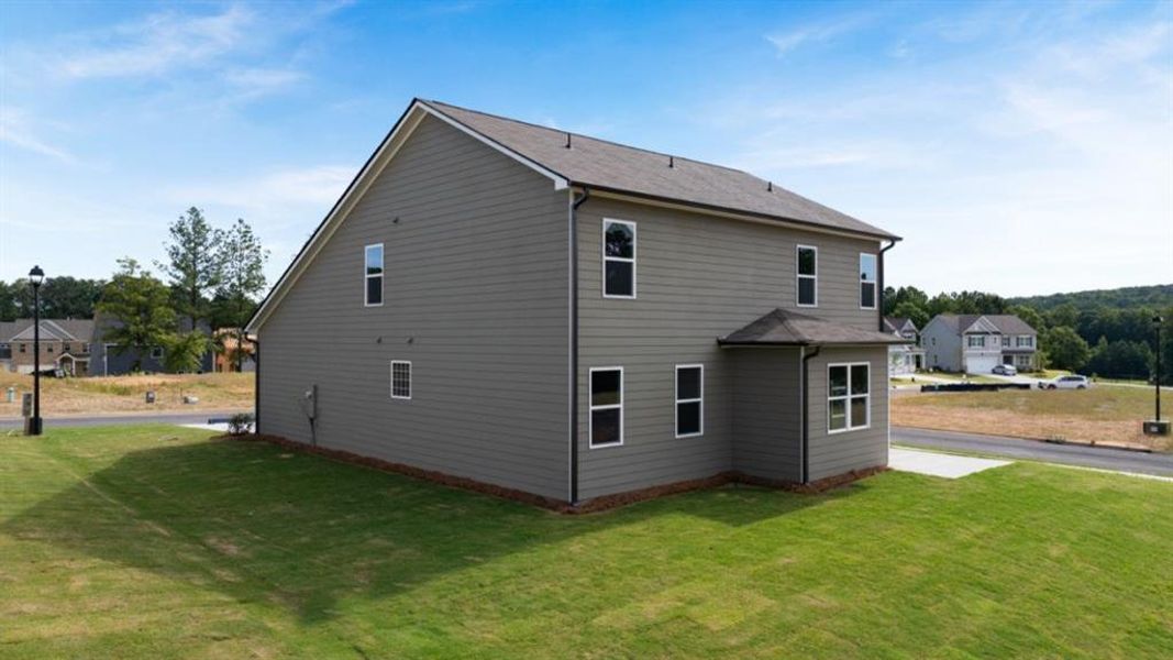Exterior details and patio area of a home in Fairway 17 at Mirror Lake, Villa Rica (Image 3).