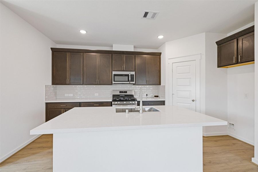 Furnished interior view inside a new home in Sunterra, Katy (Image 14).