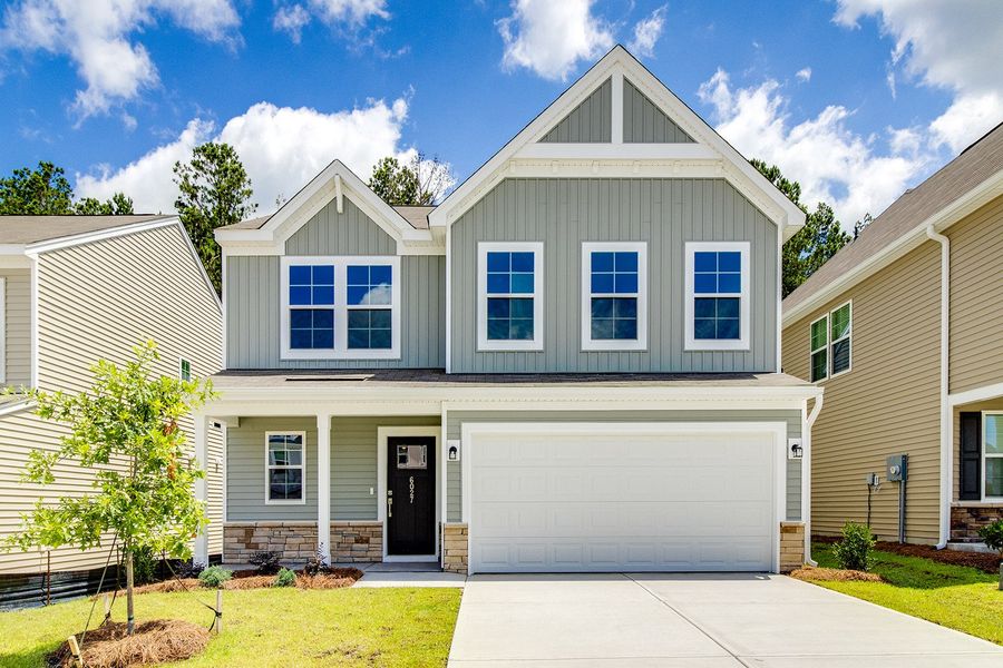 Front exterior of a new home in Ellington, Elgin, SC, highlighting curb appeal (Image 1). Front exterior of a new home in Ellington, Elgin, SC, highlighting curb appeal (Image 1).