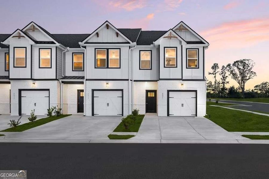 Front exterior of a new home in The Grove At Mundy Mill, Gainesville, GA, highlighting curb appeal (Image 15).