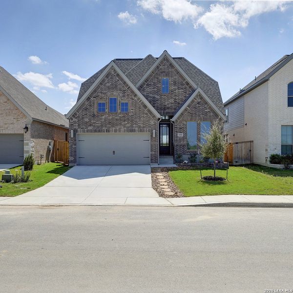 Front exterior of a new home in Arcadia Ridge, San Antonio, TX, highlighting curb appeal (Image 2).