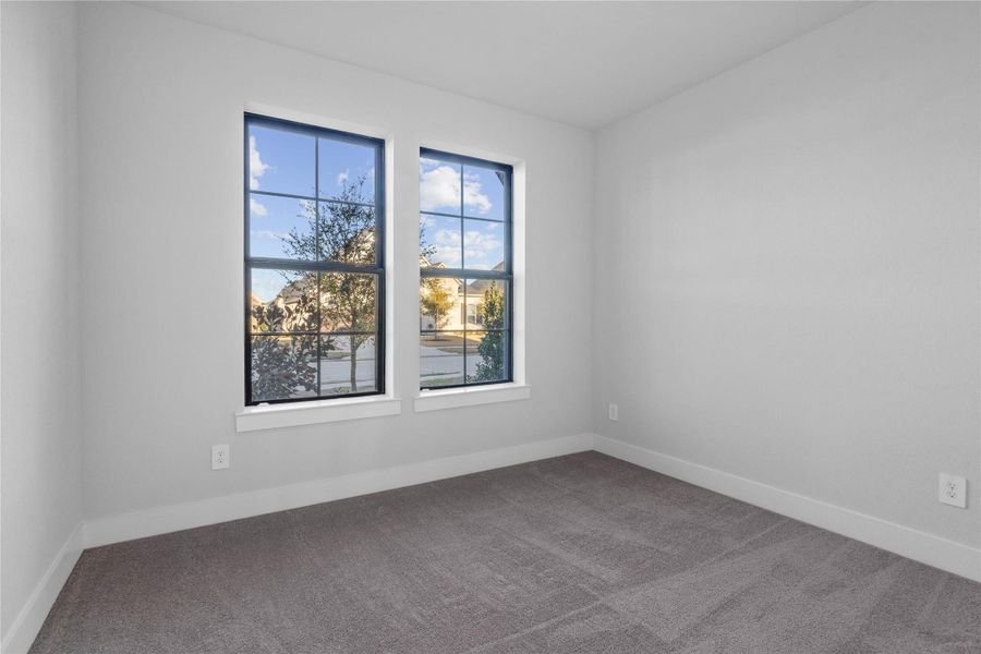 This Guest Suite offers a bright layout with neutral finishes and natural light. Featuring plush carpeting, large windows and an en-suite secondary bathroom.