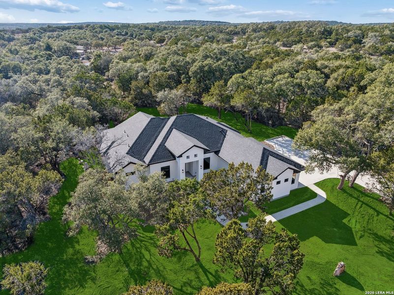 Front exterior of a new home in , Spring Branch, TX, highlighting curb appeal (Image 35).