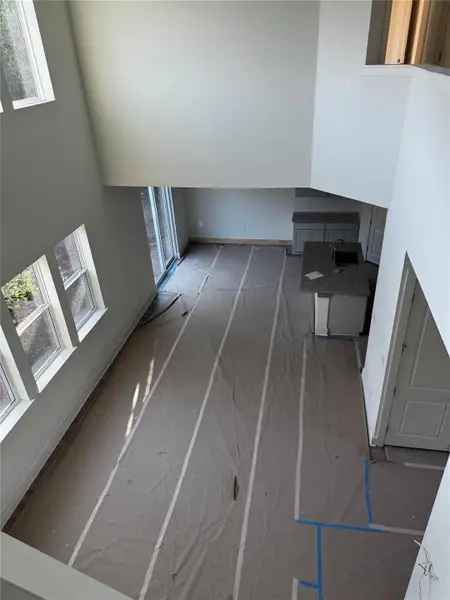 Unfurnished living room featuring baseboards Unfurnished living room featuring baseboards