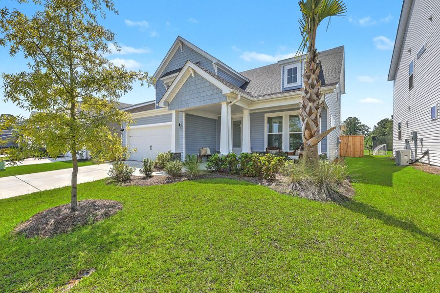 Front exterior of a new home in The Groves of Berkeley, Moncks Corner, SC, highlighting curb appeal (Image 22). Front exterior of a new home in The Groves of Berkeley, Moncks Corner, SC, highlighting curb appeal (Image 22).