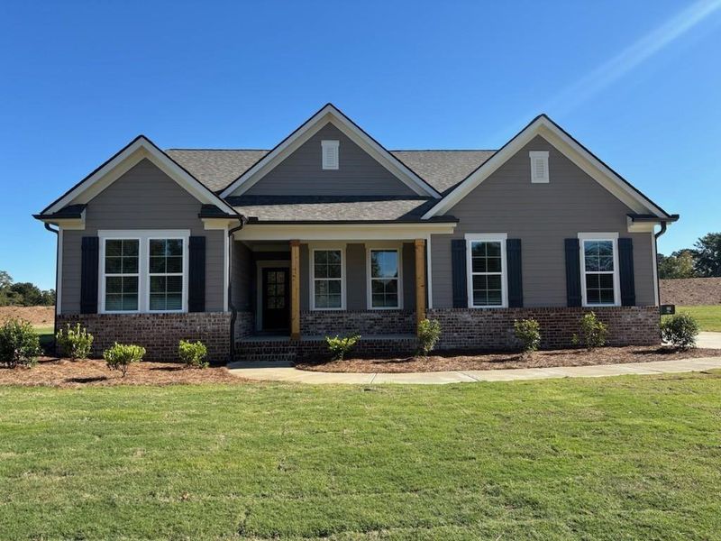 Front exterior of a new home in Magnolia Ridge, Monroe, GA, highlighting curb appeal (Image 27).
