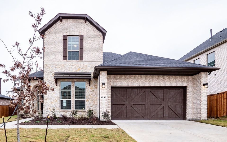 Front exterior of a new home in Sonoma Verde, Rockwall, TX, highlighting curb appeal (Image 1). Front exterior of a new home in Sonoma Verde, Rockwall, TX, highlighting curb appeal (Image 1).